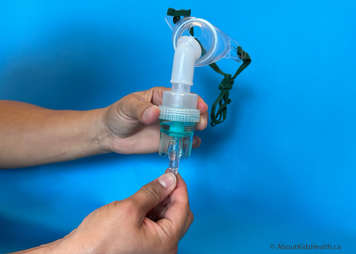 Attach the oxygen tubing to the underside of the nebulizer cup