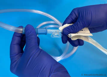 Suction tubing being attached to a suction catheter