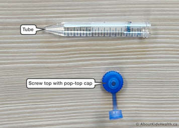 Dissolve-and-dose showing the blue screw top with the removable pop-top cap and the tube