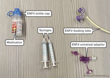 supplies including enfit bottle cap, medication, syringes, enfit feeding tube, enfit universal adaptor