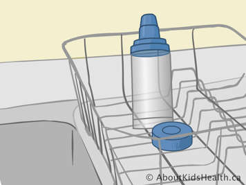 Adapter and spacer with mouthpiece placed upright on drying rack