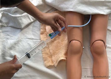 syringe plunger pulled all the way out with some sediment