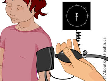 Child wearing blood pressure cuff