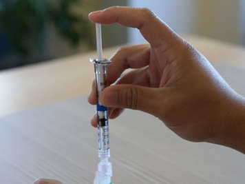 Air being injected into the medication vial