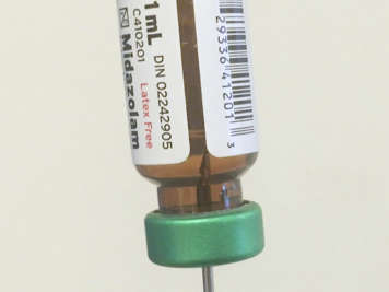 Vial showing the needle in the liquid medication