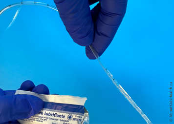 Water-soluble lubricant being applied to the suction catheter