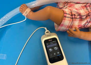 Oximeter on child's foot showing accurate readings