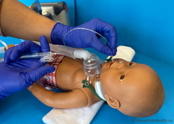 Without the thumb over the suction port the suction catheter is inserted into the child's mouth