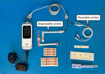 Oximeter with supplies highlighting a disposable probe and a reusable proble