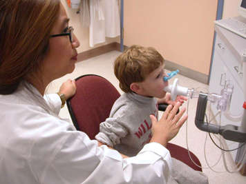 Child undergoing pulmonary function test