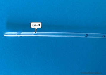 Close up of the eyelet on a suction catheter