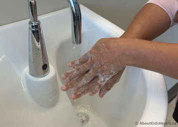 Caregiver washing their hands